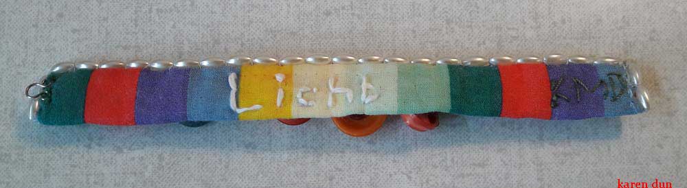 from re-used fabrics buttons and beads